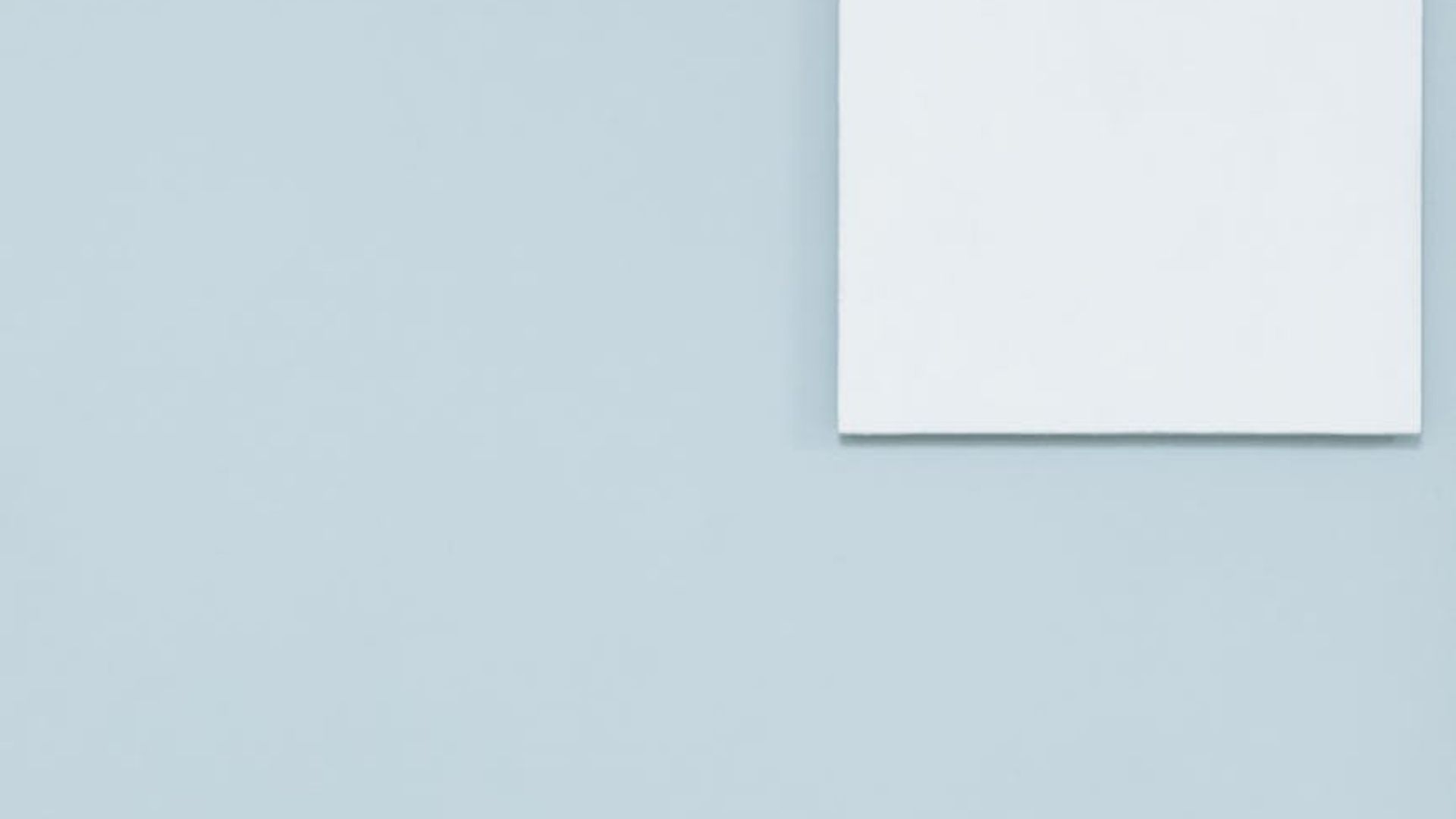 Abstract dark background with subtle light flares resembling a calm space.